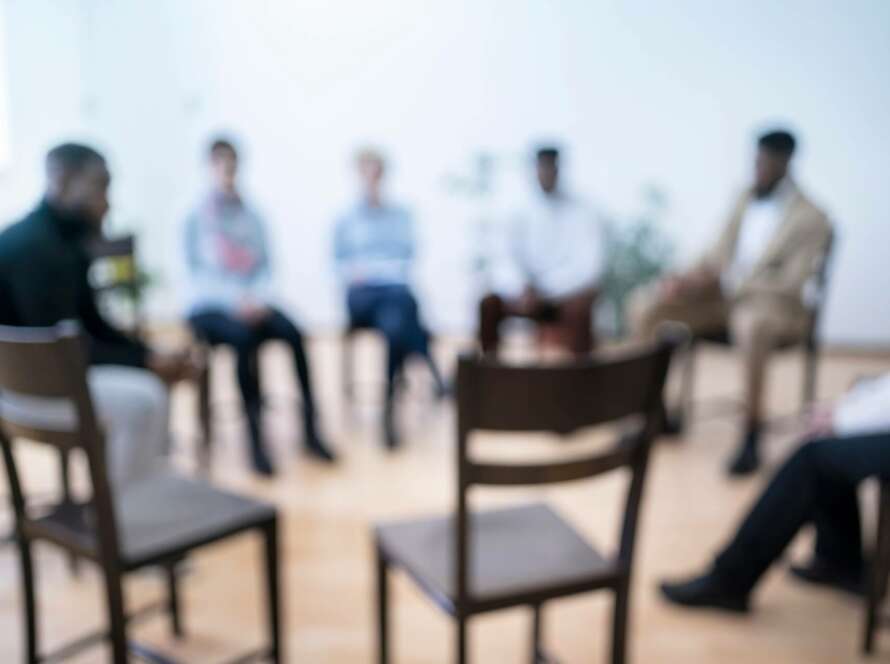 unfocused, blurry picture of group therapy circle